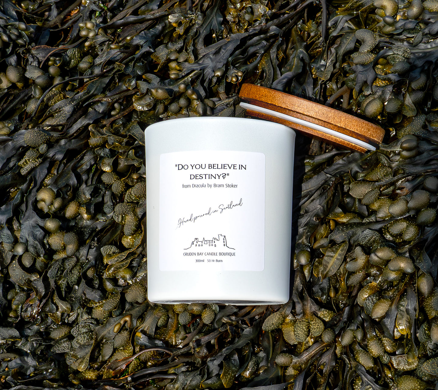 Do you believe in destiny candle with a marine scent and background in Cruden Bay beach