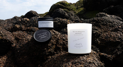 Do you believe in destiny candle with a marine scent and background in Cruden Bay beach